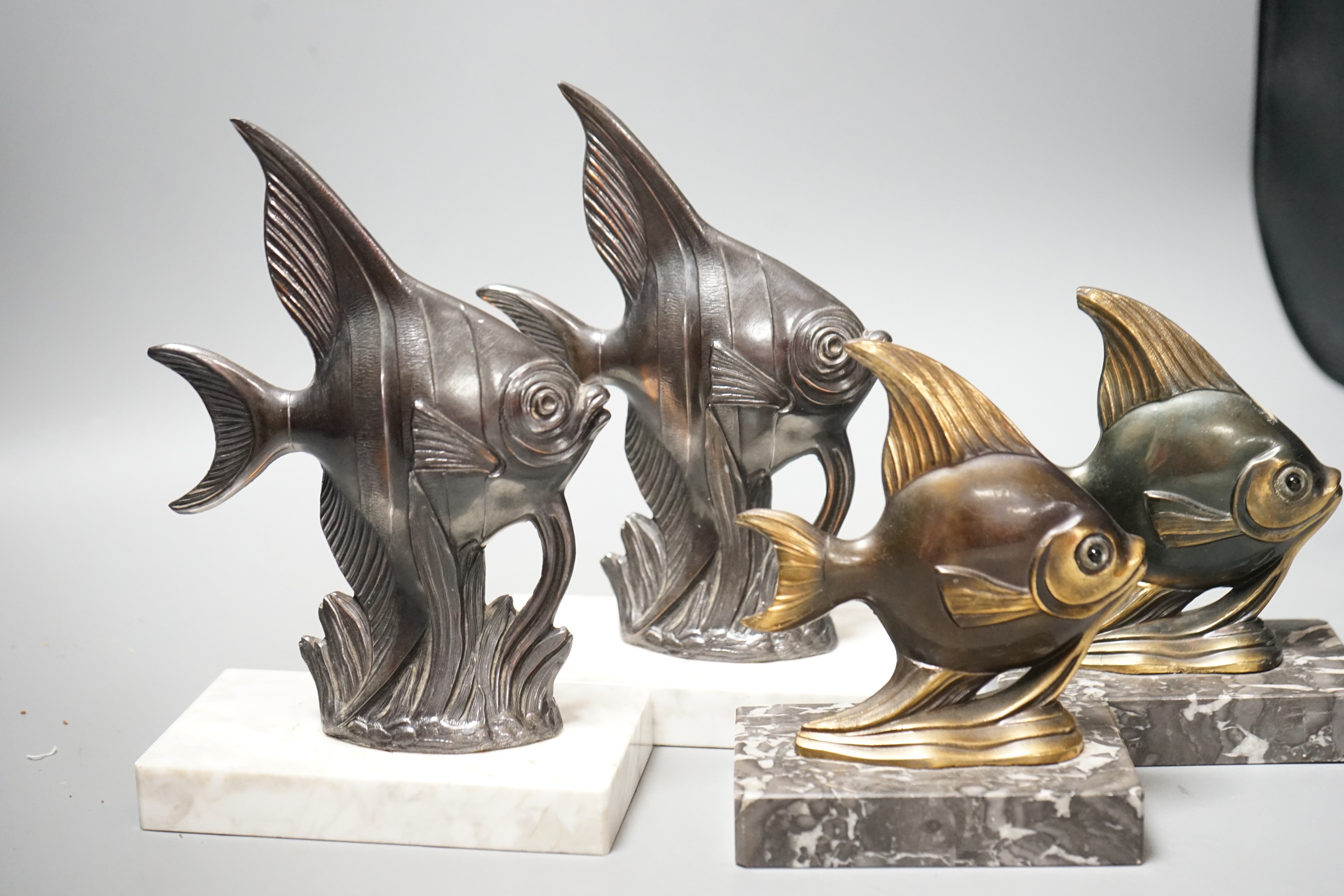 Two pairs of Art Deco spelter 'Angel fish' bookends. Tallest pair 20cm